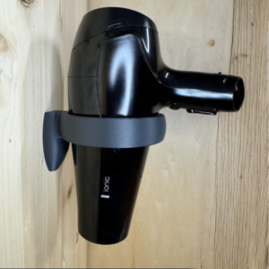 Soporte de pared para secadora de cabello.